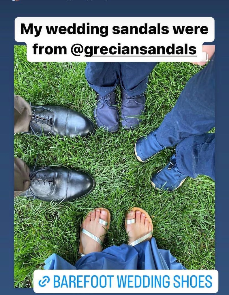 May include: A pair of silver metallic toe-ring sandals worn with a blue dress, surrounded by black leather dress shoes and blue casual shoes. The image includes the text: My wedding sandals were from @greciansandals and BAREFOOT WEDDING SHOES.