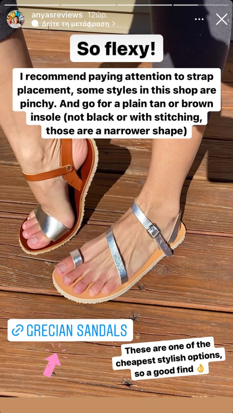 May include: A pair of flat sandals featuring metallic silver straps and a tan leather insole. One sandal has a toe loop and an ankle strap with a metal buckle, while the other features a wide metallic silver band across the forefoot and a brown ankle strap.