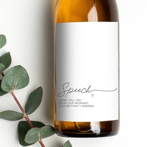 May include: A white wine bottle with a label that says "Speech" and "Names, will you speak at our wedding? Love Brittany + Andrew".