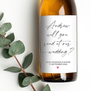 May include: A white wine bottle with a personalised label that reads "Andrew will you read at our wedding?" with the names Love Maddison & Shane and the date 17 September 2022.