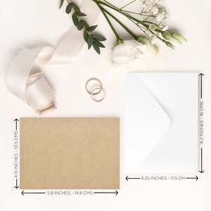 May include: Two white envelopes, one with a kraft brown envelope, measuring 4.15 by 5.8 inches, and the other measuring 4.25 by 6.2 inches.  Two gold rings are on a white surface.