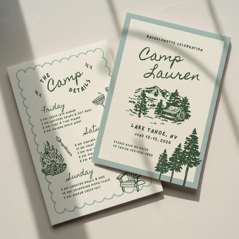 May include: Two rectangular paper cards with cream backgrounds and light blue borders. One card features the text Camp Lauren, a mountain cabin illustration, and event details. The other card lists The Camp Details for Friday through Sunday.