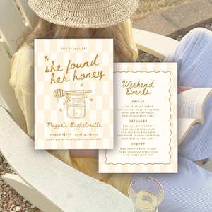 May include: A bachelorette party invitation set featuring a cream and white checkered background. The front card displays the text 'she found her honey' with a honey jar illustration. The second card lists 'Weekend Events' for Friday, Saturday, and Sunday in gold script and print text.