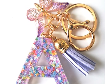 Llavero personalizado de resina con purpurina y inicial, con dije de mariposa, ideal para el Día de la Independencia.