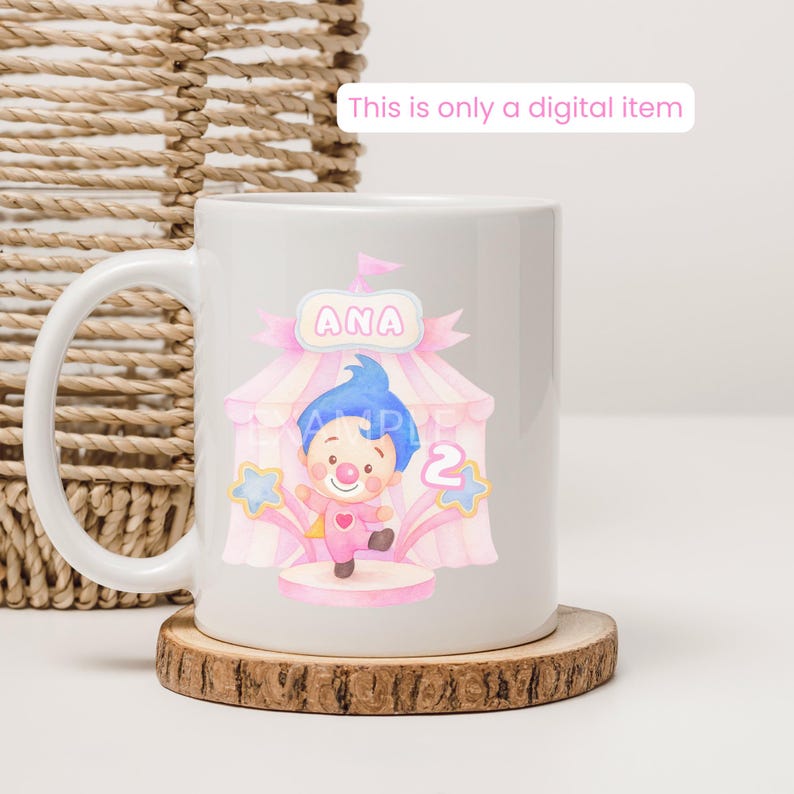 May include: White ceramic mug featuring a colorful circus-themed design with a clown, the name "ANA", and the number "2". The design includes pink and blue accents, stars, and a circus tent. The text "This is only a digital item" is also visible.