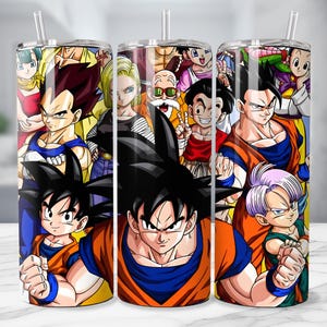 May include: Three stainless steel tumblers with a colorful anime-style design featuring various characters. Each tumbler has a clear straw and a vibrant, detailed illustration of the characters in action poses.
