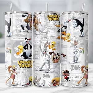 May include: Three stainless steel tumblers with Looney Tunes characters printed on them. The tumblers feature Bugs Bunny, Daffy Duck, Sylvester, Tweety Bird, and other characters. The background has a newspaper-like design with the words "Looney Tunes".