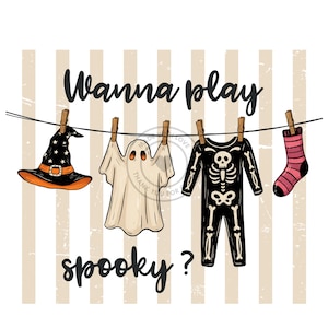 May include: A graphic illustration featuring a black witch hat, a white ghost, a black skeleton jumpsuit, and a pink and black striped sock hanging on a clothesline. The text reads Wanna play spooky? against a background of vertical beige stripes.