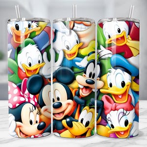 May include: Three stainless steel tumblers with colorful cartoon character designs. The designs feature Mickey Mouse, Minnie Mouse, Donald Duck, Daisy Duck, Goofy, and other Disney characters. Each tumbler has a clear straw and a white lid.