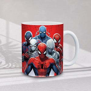 May include: White ceramic mug featuring a group of Spider-Man characters in various costumes against a red background. The design includes Spider-Man in red and blue, and other versions of the character.