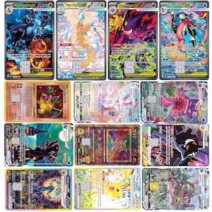 May include: A collection of twelve rectangular trading cards featuring various colorful Pokémon characters, each with a metallic gold chip embedded in the center, displaying detailed illustrations, text, and numerical statistics on their surfaces.