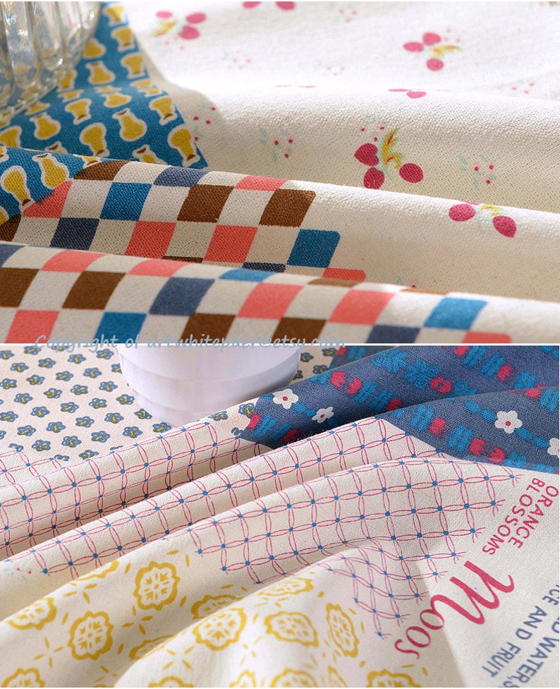 K&ouml;nnte beinhalten: Ein Patchwork-Stoff mit verschiedenen Mustern, darunter florale, karierte und geometrische Designs. Der Stoff ist in Blaut&ouml;nen, Rosa, Gelb und Braun gehalten. Der Stoff ist gefaltet und hat eine strukturierte Oberfl&auml;che.