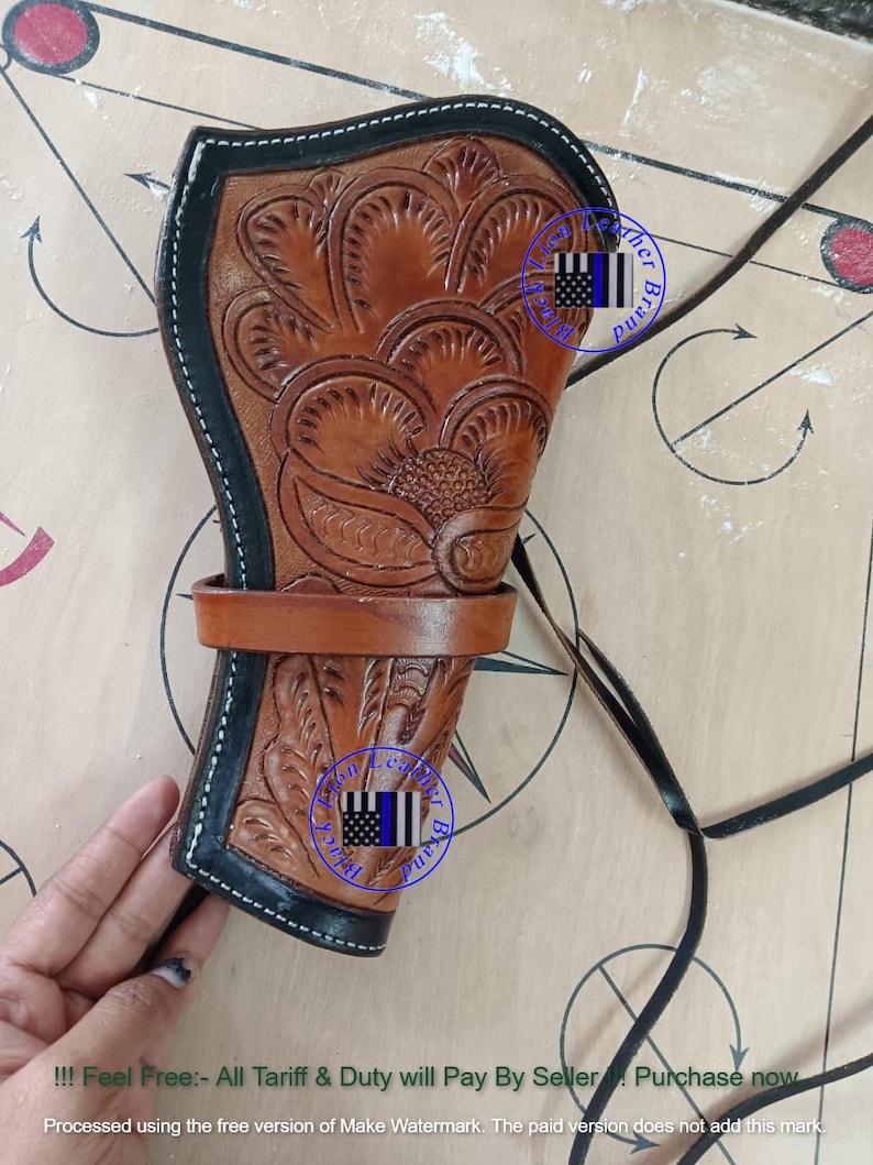 Pode incluir: Uma coldre de couro castanho com detalhes florais e acabamento preto. Possui uma correia e um cord&atilde;o preto. O texto "!!! Feel Free:- All Tariff & Duty will Pay By Seller. Purchase now" &eacute; vis&iacute;vel na parte inferior.