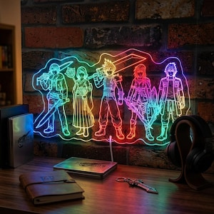 May include: A colorful LED light featuring a group of anime-style characters with swords and weapons. The light is mounted on a wooden surface with a brick wall background. Other items include a notebook, headphones, and a keychain.