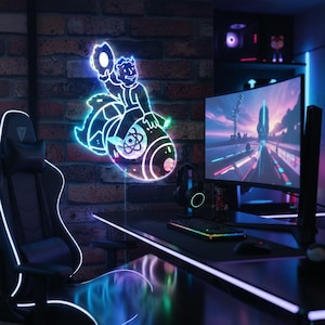 May include: A neon sign showing a cartoon figure on a bomb, mounted on a brick wall. The sign glows with blue, green, and pink lights. A gaming setup with a curved monitor, keyboard, and chair is visible.