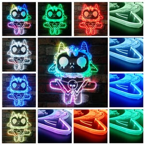 May include: A selection of vibrant LED neon lights shaped like a cartoon goat character. The lights display a range of colours, such as green, red, blue, and white. The character features a skull-like face and a geometric design.