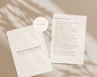 May include: A PDF download featuring soft journaling prompts. The image displays two pages with text, one titled "SOFT JOURNALING PROMPTS" and the other "ALIGNMENT & SOFT VISION." The prompts are designed for calm, clarity, and self-connection. The background is a neutral beige.