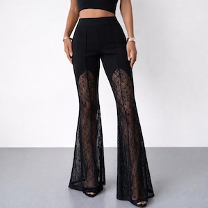 May include: Black flared pants with lace inserts. The pants have a high waist and a flared leg design. The lace detailing adds a touch of elegance to the overall look. The pants are made of a solid black material.