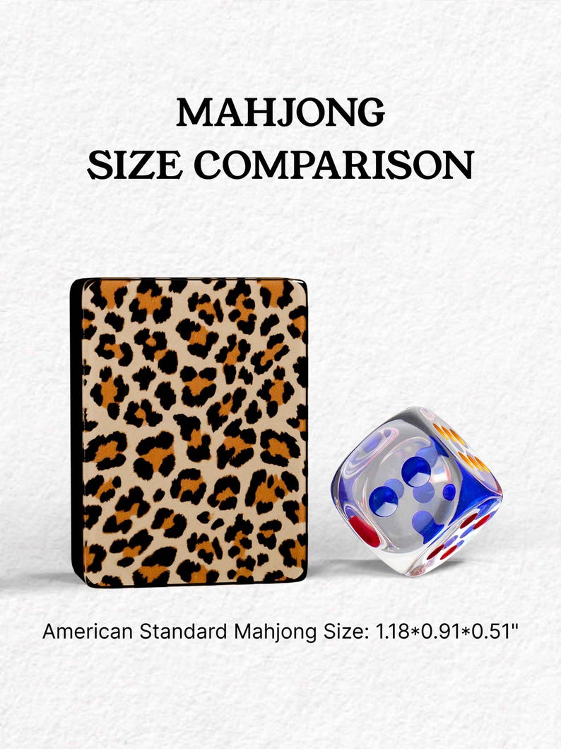 The image is a comparison of the size of a Mah Jongg card and a dice, with the card being leopard print and the dice being clear with blue and red dots.