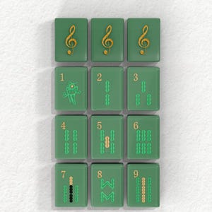 a collection of green tiles with musical notes and numbers on them, arranged in a grid pattern.