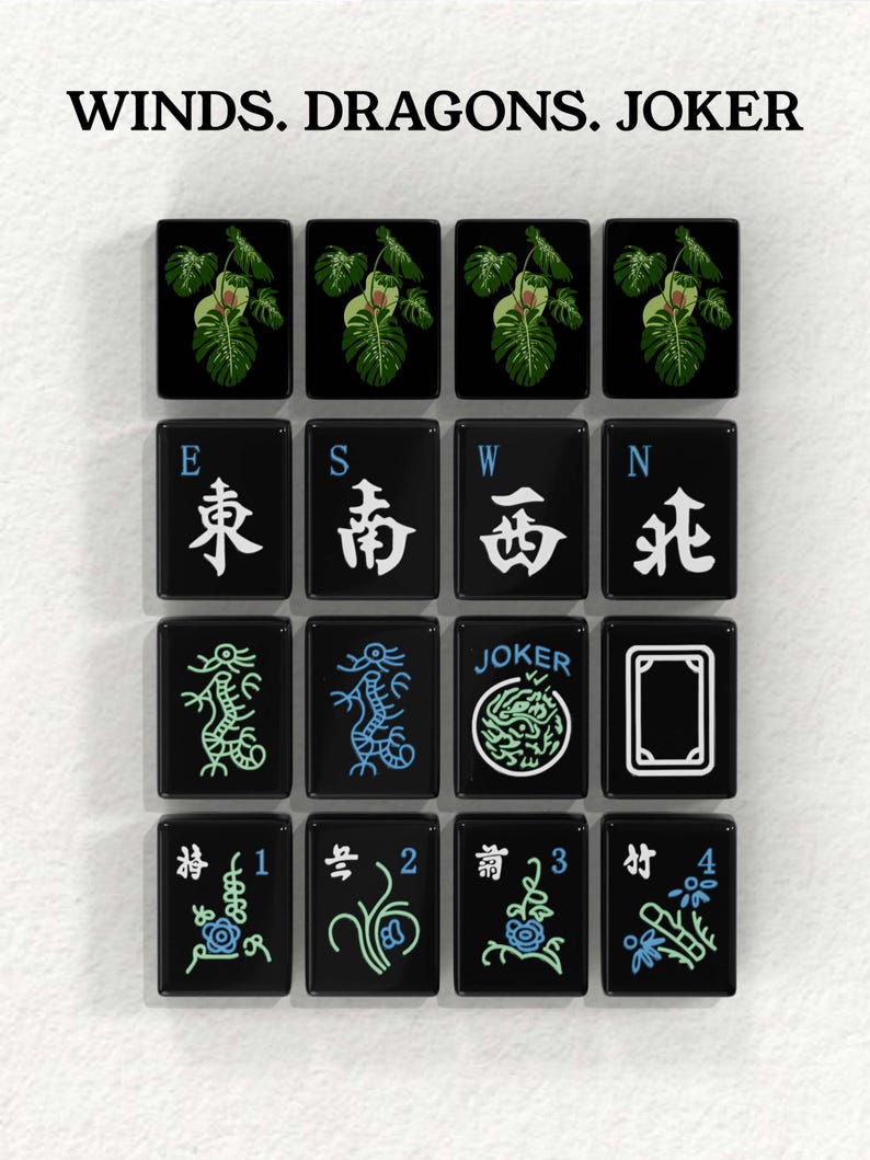 a collection of black and white tiles with various symbols and designs, including images of plants, dragons, and a joker.