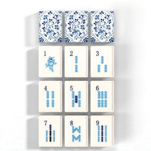 a collection of blue and white tiles arranged in a grid pattern, with each tile featuring a unique design or pattern.