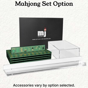 a set of mahjong tiles and a clear glass display case, with the text "Mahjong Set Option" and "Accessories vary by option selected."