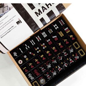 a set of mahjong tiles arranged in a box, with the text "Mahjong Set Only" visible.