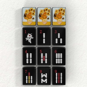 The image is a collage of nine black tiles, each containing a different image. The tiles are arranged in a 3x3 grid, with each tile displaying a different image. The tiles include images of flowers, sunflowers, and other floral arrangements. The tiles are arranged in a visually appealing manner, showcasing the variety of images within the collage.