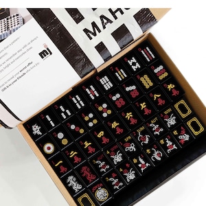 a set of mahjong tiles arranged in a box, with the text "Mahjong Set Only" visible.