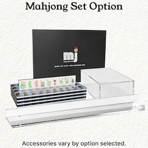 a set of mahjong tiles and a clear plastic case, with the text "Mahjong Set Option" and "Accessories vary by option selected."