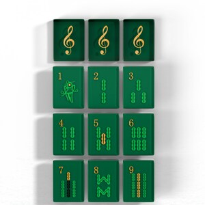 nine green tiles with musical notes and numbers on them, arranged in a 3x3 grid.