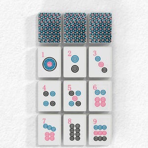 The image is a collage of nine tiles, each with a unique pattern and number, arranged in a grid format. The tiles are white with black and pink accents, and they depict various geometric shapes and patterns. The tiles are arranged in a 3x3 grid, with the top row consisting of the first three tiles, the middle row containing the next three tiles, and the bottom row featuring the remaining three tiles.