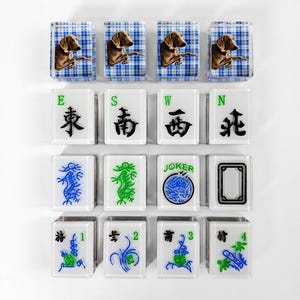 a collection of 16 square tiles, each featuring a different design or symbol. The tiles are arranged in a grid pattern, with four tiles on the top row, four tiles on the middle row, and four tiles on the bottom row. The tiles are predominantly white, with some featuring blue and green accents. The tiles display various symbols and designs, including a dog, a joker, and a number 1, 2, and 3.