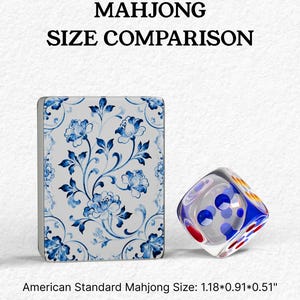 a Mah Jong-style game board with a floral pattern and a clear glass dice with colorful dots on it.