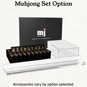 a set of mahjong tiles and a clear plastic display case, with the text "Mahjong Set Option" and "Accessories vary by option selected."