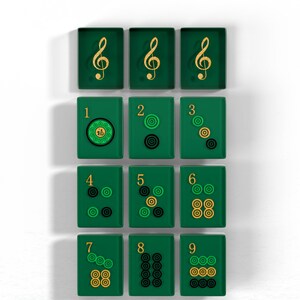 A collection of green tiles with musical notes and numbers on them, arranged in a grid pattern.