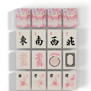 a collection of pink and white tiles with various designs and symbols, including Chinese characters, dragons, and the word "JOKER".