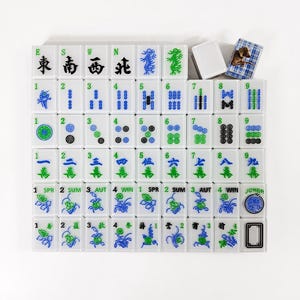 a grid of tiles with various symbols and numbers on them, arranged in a visually appealing layout.