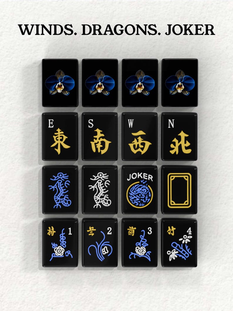 a collection of black tiles with various symbols and designs, including a joker, winds, dragons, and a flower.