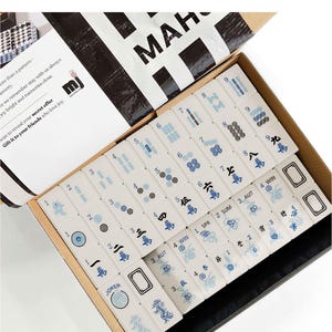 a set of mahjong tiles in an open box, with the text "Mahjong Set Only" visible.
