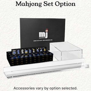a set of mahjong tiles and a clear plastic display case, with the text "Mahjong Set Option" and "Accessories vary by option selected."