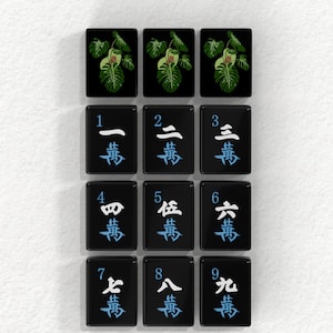 a collection of tiles with various characters and symbols on them, arranged in a grid pattern.