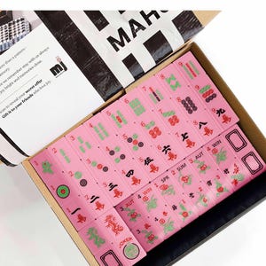 a set of pink mahjong tiles arranged in a box, with the text "Mahjong Set Only" visible.