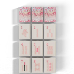 The image is a collage of nine tiles, each with a different design or pattern. The tiles are arranged in a grid-like pattern, with each tile having a unique design or pattern. The tiles are displayed against a white background, and the text "BAMBOOS TILES" is written above the image.
