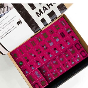 a set of mahjong tiles in a box, with the text "Mahjong Set Only" visible.