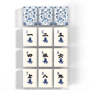 a collection of tiles with various patterns and numbers, likely representing a game board or tiles for a game.