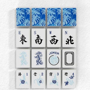 a collection of playing cards with various designs and symbols, including the words "Winds. Dragons. Joker" and the numbers 1-4.