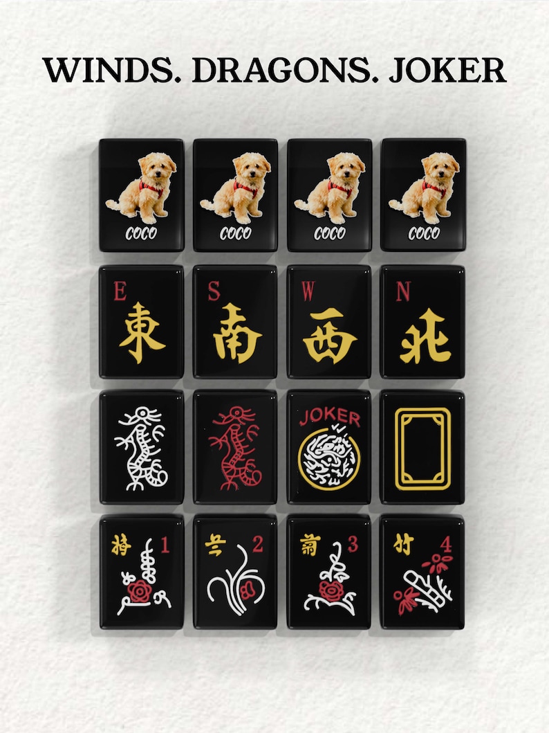 a collection of black and gold tiles with various symbols and designs, including images of dogs, dragons, and a joker.