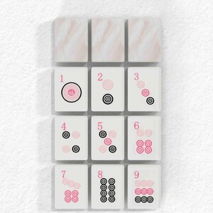 A grid of nine tiles, each with a unique design, arranged in a 3x3 grid against a white background.